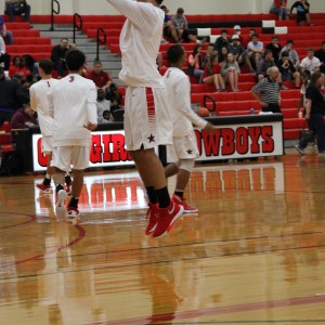 Coppell High School senior guard Alex Vuchkov warms up to defeat Mansfield Timberview. The Cowboys beat the Wolves Friday at home in the large gym 54-52. 