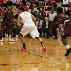 Coppell High School senior guard Alex Vuchkov runs the ball down the court on offense against Mansfield Timberview. The Cowboys beat the Wolves Friday at home in the large gym 54-52.