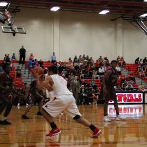 Coppell High School senior guard Alex Vuchkov shoots the ball on offense against Mansfield Timberview. The Cowboys beat the Wolves Friday at home in the large gym 54-52.