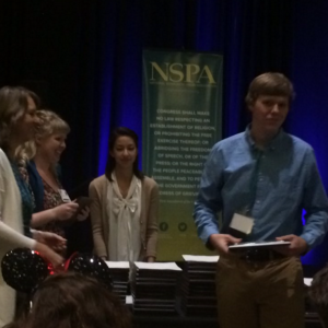 Coppell High School senior Nick Wilson receives an award on behalf of himself and CHS alumni Hailey Hess on Nov. 15 during the JEA/NSPA Fall National High School Journalism Convention in Orlando, Fla., placing fourth for Best Broadcast Feature for their work on “Spirit Horse”. Photo courtesy of KCBY-TV. 