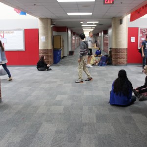 Karl Gscheidle’s physics class tests handmade catapults in the main hallway of Coppell High School on Monday. Students create these every year in order to learn about the topic of velocity and distance. Photo By Chelsea Banks. 