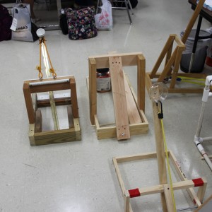  Karl Gscheidle’s physics class constructs catapults in order to test velocity and the distance they cover. Students tested these catapults Monday in the main hallway of Coppell High School. Photo By Chelsea Banks.