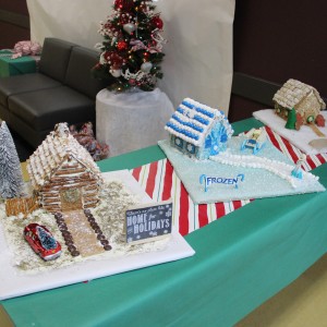 Three decorated gingerbread houses are put on display at the Santa’s Workshop at the CORE, formerly known as Coppell Aquatic and Recreation Center, on Dec.12. In addition to these, there were smaller gingerbread houses that children at the Santa’s Workshop could make for themselves. Photo by Ayoung Jo.