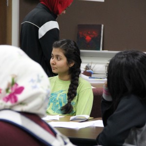 Coppell High School junior Kabila Patel watches a video about Syrian refugees at the Humanitarian Society meeting Tuesday after school. Patel is the secretary of the club for this school year and is also involved in HOSA and Red Cross which are other clubs with humanitarian values. Photo by Ayoung Jo.