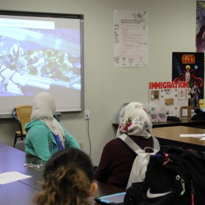 Members of the Humanitarian Society of Coppell watch a video about Syrian refugees at the club meeting on Tuesday in Room C235. The club is planning to hold a kitchen supply drive for the holiday season and anyone interested is encouraged to donate kitchenware to the box located in the sponsor and English teacher Alex Holmes’ room at C235. Photo by Ayoung Jo.