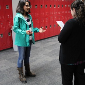 Coppell High School English teacher Amy Wilkinson listens to senior Mariana Bulgarelli at the TEDxYouth talk auditions Wednesday after school outside of social studies teacher Chris Caussey’s room. Bulgarelli has a passion for healthy lifestyle and wants to promote all of the benefits of eating healthy, especially at school. Photo by Ayoung Jo.