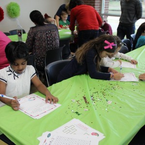 Children attending the Santa’s Workshop write their letters to Santa at the CORE, formerly known as Coppell Aquatic and Recreation Center, on Dec.12. They later had the chance to present their letters to Santa and take pictures while sitting on his lap. Photo by Ayoung Jo.