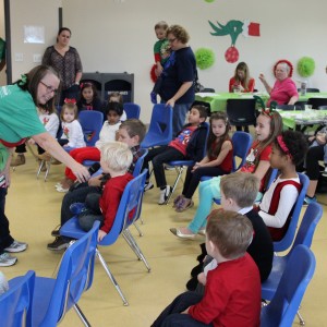 Recreation Supervisor Shelley Abraham asks the names of all of the children at the Santa’s Workshop at the CORE, formerly known as Coppell Aquatic and Recreation Center, on Dec.12. Abraham got the children excited by clapping and introduced the Grinch as he came into the room. (Video below) Photo by Ayoung Jo. 