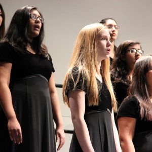 The Coppell High School Bella Voche choir performs the first song of tonight's performance during the Winter Choir concert. The show began at 7:30 p.m. in the CHS auditorium, where many different choirs performed. Photo by Amanda Hair.