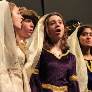 During Tuesday night’s performance, the Madrigals choir sings one of their three songs of the winter choir concert. A variety of choirs sang holiday songs, along with some more traditional songs in the Coppell High School auditorium. Photo by Amanda Hair.