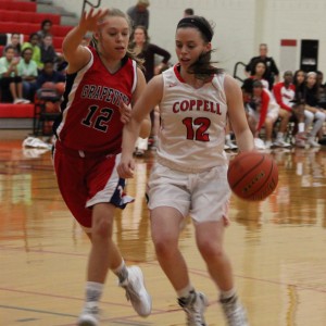 Coppell High School senior shooting guard Kaeli Stayer dribbles across the court in the Cowgirls 33-32 victory over Grapevine Tuesday night at Coppell High School.  