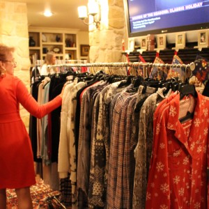 Shoppers look at pajamas sold at Laura Swaldi’s annual holiday show on Dec. 9 at her home. Other goods and possible holiday presents were available for purchase such as Coppell’s famous Spirit Round-Up spiritwear. Photo by Kelly Monaghan.