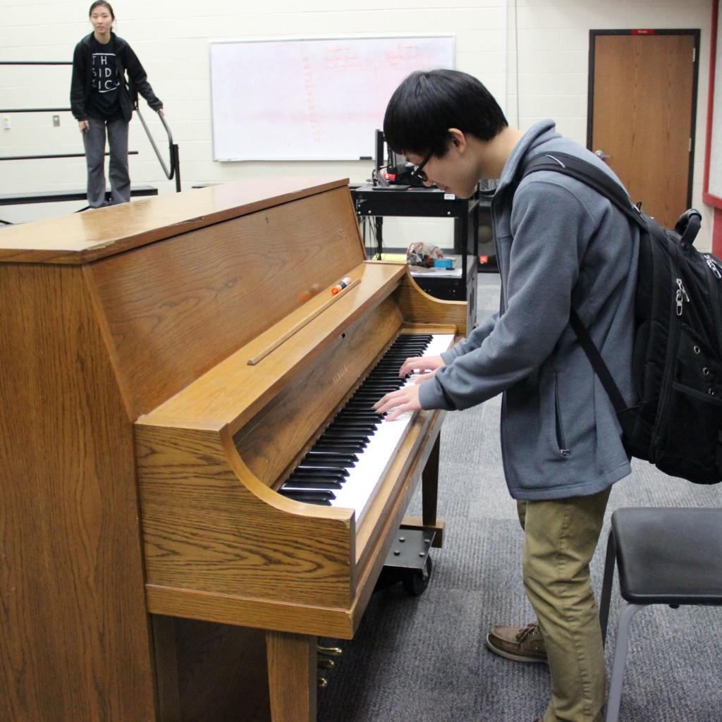 Coppell High School junior Sean Wang practices piano in the choir room on Dec. 3. Wang has played piano for nine years and saxophone for six. Photo by Jennifer Su. 