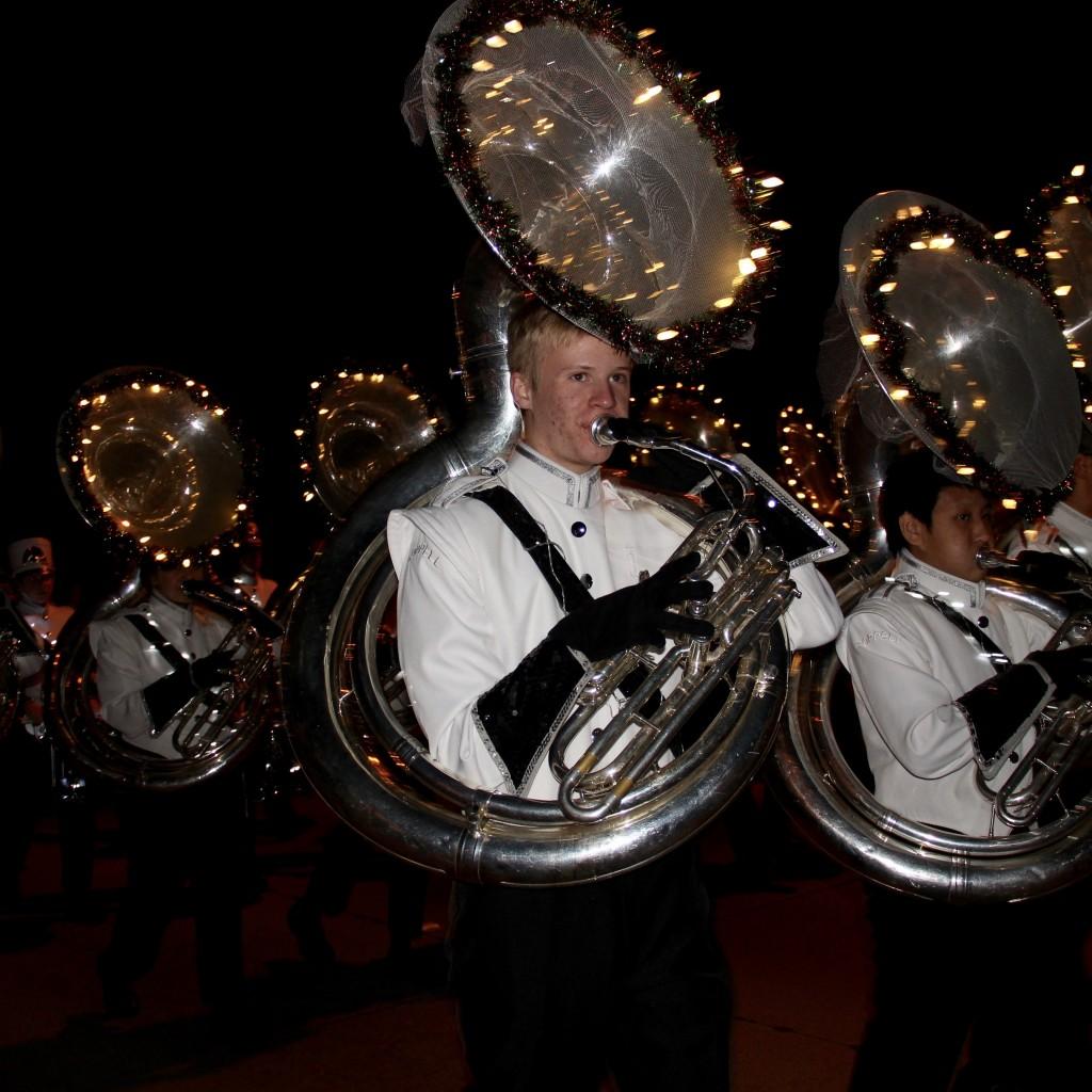 Coppell High School senior Alan Ritchie plays his tuba and marches with the band at the annual Coppell Holiday Parade on Dec. 5 at the Coppell Town Center plaza. The Coppell Band is the recipient of numerous awards, championships and honors, ranging from local and state contests to the prestigious Tournament of Roses Parade. Photo by Jennifer Su.