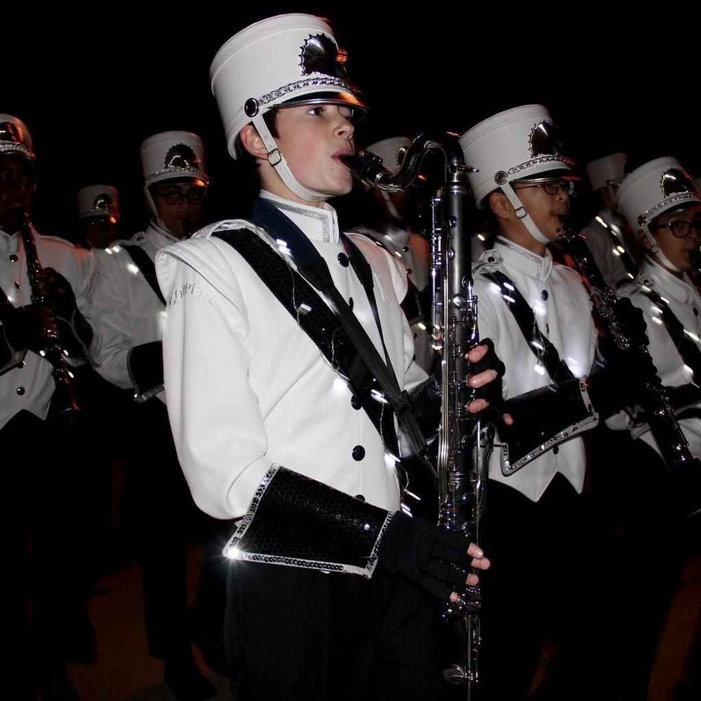 Coppell High School freshman Justin Gross marches with his bass clarinet at the annual Coppell Holiday Parade on Dec. 5 at the Coppell Town Center plaza. The Coppell High School band is a consistent winner of the Texas State Solo and Ensemble Championship along with being a consistent finalist at the State Marching Competition. Photo by Jennifer Su.
