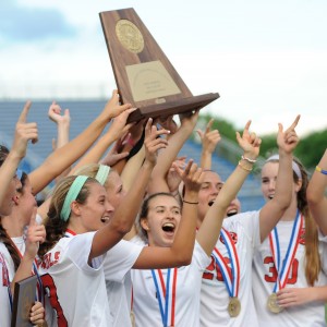 The Coppell Cowgirls soccer team celebrates after defeating Cinco Ranch to win the 2014-2015 6A State Championship.