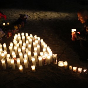 A memorial at the corner of Waterman Avenue and Orange Show Road in San Bernardino, Calif., on Thursday, Dec. 3, 2015, a day after a shooting at the nearby Inland Regional Center that killed 14 and wounded 21. (Michael Robinson Chavez/Los Angeles Times/TNS)