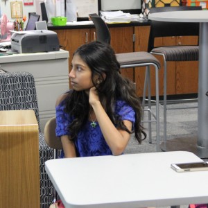 Coppell High School freshman Isabel Mascarenhas, the secretary of the Leo Club, listens to the new themed projects at the club meeting Wednesday after school in room E203. “I enjoy volunteering and service learning,” Mascarenhas said, “and I thought this would be a great opportunity to get involved with the community.” Photo by Ayoung Jo. 