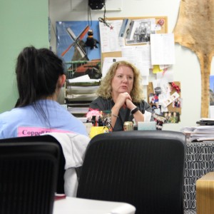 Coppell High School biology teacher Jennifer Martin gives her input on students’ ideas during the Leo club meeting Wednesday afterschool in room E203. Martin, the supervisor of the club for the school year, gave examples of fundraising works that have been successful with her past students. Photo by Ayoung Jo.