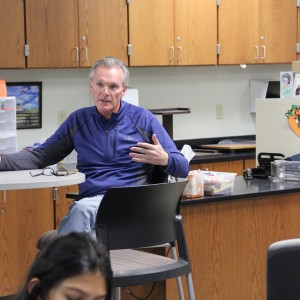 Dan Madden, Leo Club Sponsor from Coppell Lions Club, thanks the students of Leo Club for their Christmas volunteer project which raised $200 at the Leo club meeting Wednesday afterschool in room E203. Leos club works in conjunction with the Coppell Lions club, and the profits raised by the students in Leo club goes to the Lions club. Photo by Ayoung Jo. 