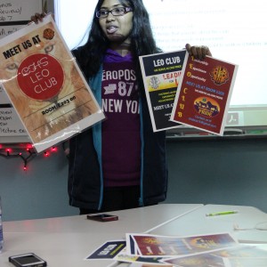 Coppell High School senior Haasitha Pidaparthi presents the Leo club posters that will soon be hung around the school during the club meeting on Wednesday in room E203. She founded the Leo club at Coppell High School after her experience with the Leo club at her old school in California. Photo by Ayoung Jo. 